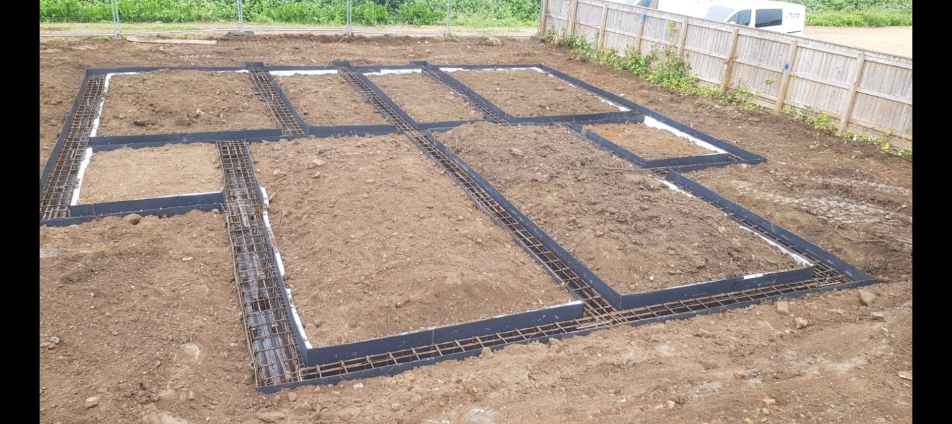 Reinforced trench foundations